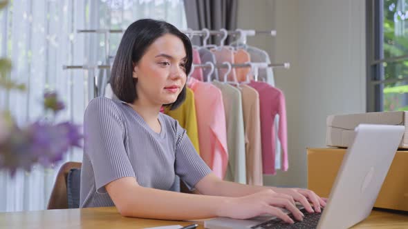 Asian attractive young girl selling product online live streaming during Covid pandemic.