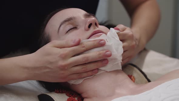 Massagist Cleaning the Skin of Her Female Client Using Wipes After the Massaging Procedure