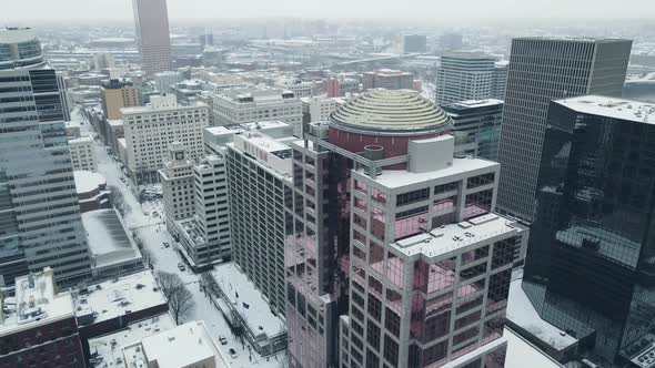 Glass Building to and Snow Covered Skyline