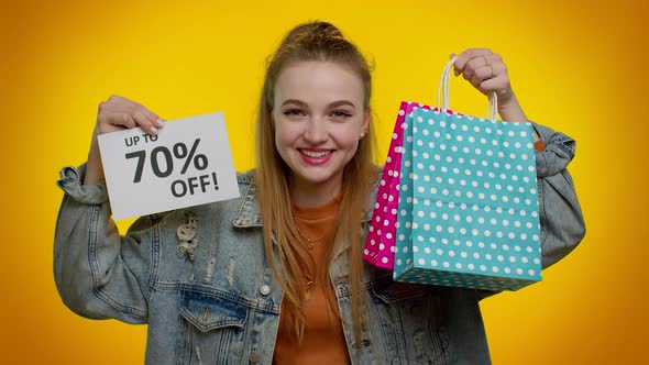 Cheerful Teen Girl Showing Shopping Bags and Up To 70 Percent Off Inscriptions Banner Black Friday