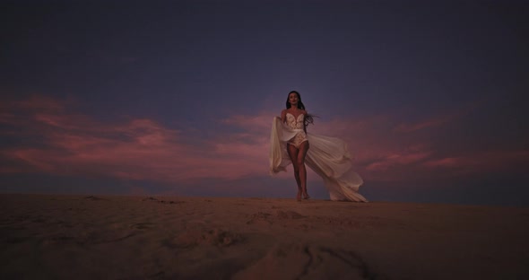 Beautiful Young Woman Walking Through the Romantic