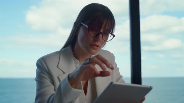 Focused Ceo Working Tablet in Suit Closeup