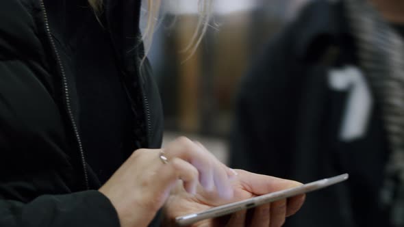 Woman in Mask Texting Mobile Message in Underground