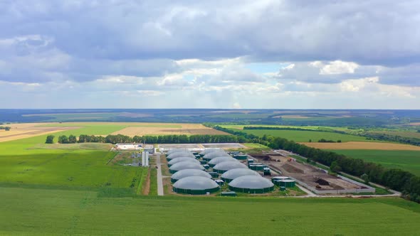 Modern biogas plant in summer. Greenhouse complex for biogas production