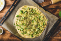 Raw Italian pizza with broccoli, pesto and cheese - PhotoDune Item for Sale