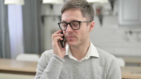 Portrait of Young Man Talking on Phone