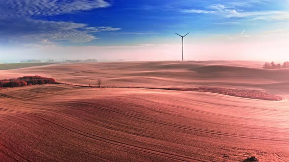 Foggy brown field at sunrise, view from above, Poland