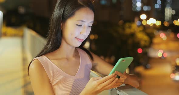 Woman use of cellphone at night 