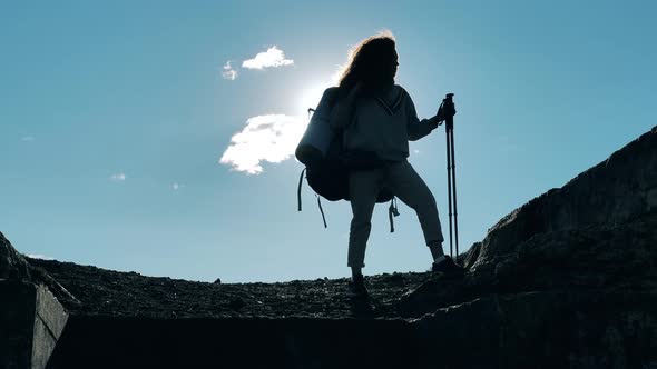 Female Sports Tourist Is Standing in the Ruins and Enjoying the Rest