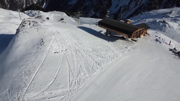 Majestic Winter Aerial Landscape and Ski Resort with Typical Alpine Wooden Houses in French Alps