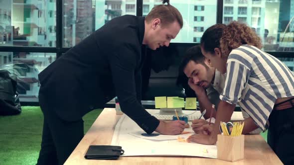 Creative Business People Group Having Conversation at Office Desk in Workplace