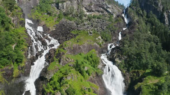 Drone Of White Water Cascading Down Rocky Mountainside