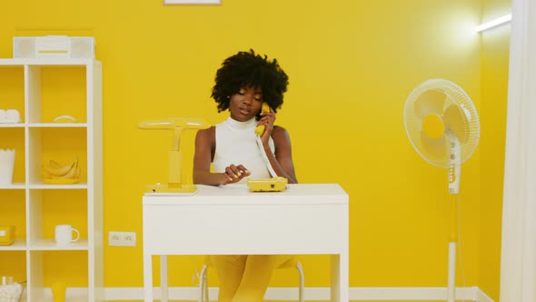 Black Woman Has Phone Conversation In Creative Office