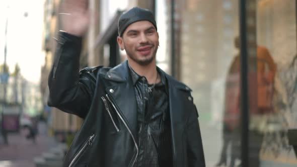 Joyful Caucasian Gay Man Walking on City Street Waving Talking Smiling Leaving