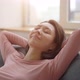 Attractive young asian woman resting on cozy sofa at home - VideoHive Item for Sale