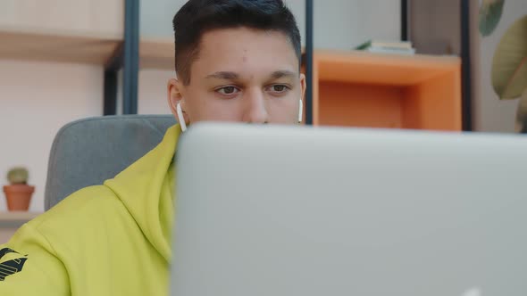 The Face of a Student Sitting in a Room at the Computer