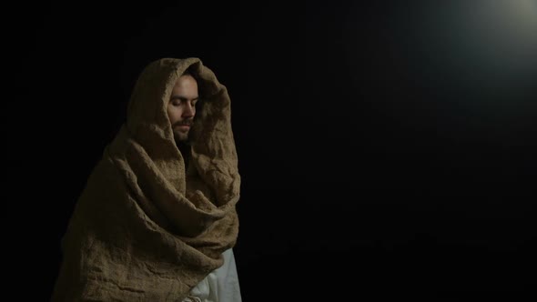 Man in Robe Coming Out of Darkness and Looking to Camera, Biblical Messiah, God