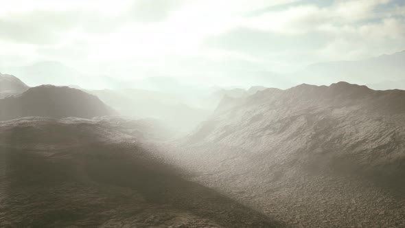 Aerial Vulcanic Desert Landscape with Rays of Light