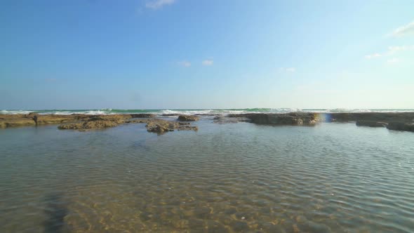 Shallow Rocky Reef Between the Sea and the Beach