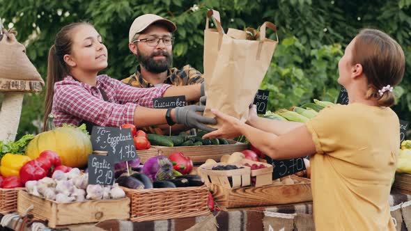 Woman Buying Organic Groceries at Farmers Market