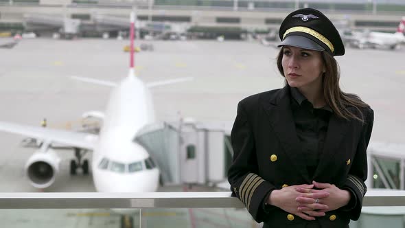 Professional Female Pilot in Uniform at Airport