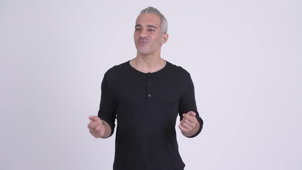 Happy Handsome Persian Man Talking Against White Background
