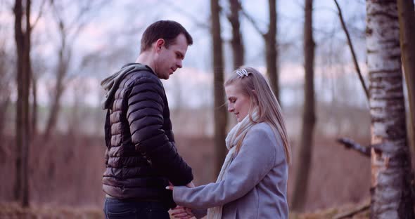 Young People Hugs in the Autumn Forest