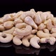 Cashew nuts rotating on a black background. Cashew, organic ecological nuts isolated. - VideoHive Item for Sale