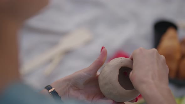 Women Sculpt From Clay in Nature Outdoors in the Park