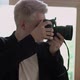 Man Photographer Takes Photographs on a Professional Camera - VideoHive Item for Sale