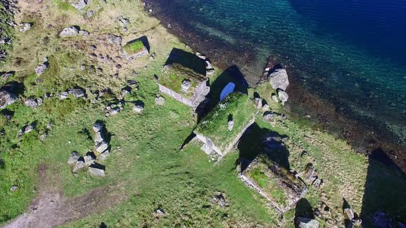 Old Norwegian settlement by lake, aerial view