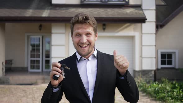 Satisfied Excited Caucasian Man in Suit Dancing Gesturing Thumb Up Smiling Looking at Camera