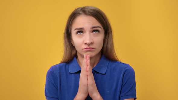 Closeup Worried Crying Lady United Hands Praying Help Posing Isolated on Orange Studio