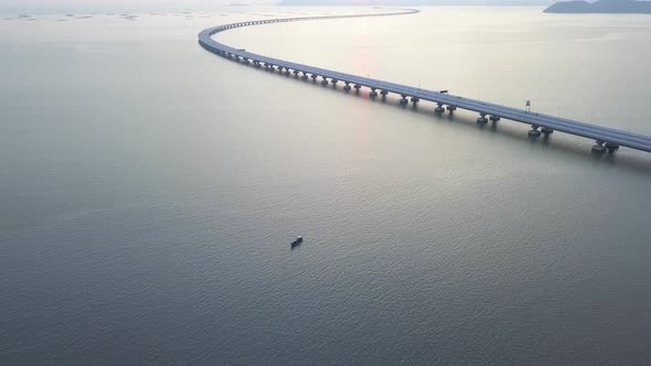 Aerial view fishing boat beside architecture Penang Second Bridge