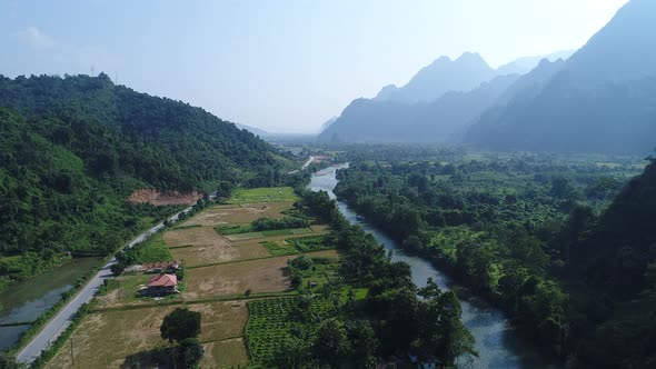 Landscape around the city of Vang Vieng in Laos seen from the sky alt