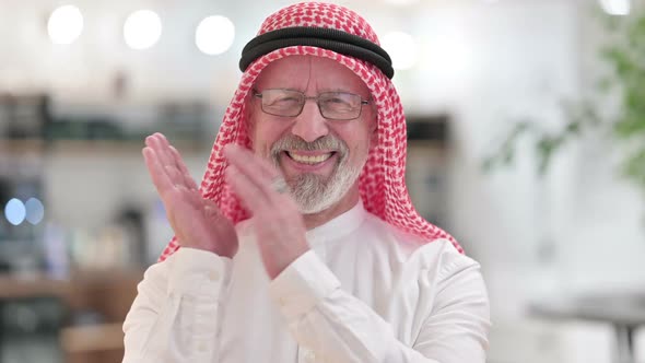 Appreciative Senior Old Arab Businessman Clapping