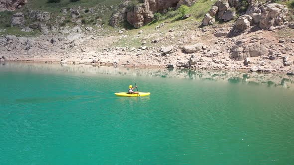 Man Canoeing On The Lake