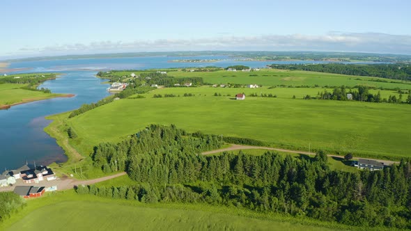 French river, Prince Edward Island. River feeds into bigger body of water. Beautiful summer day. Aer