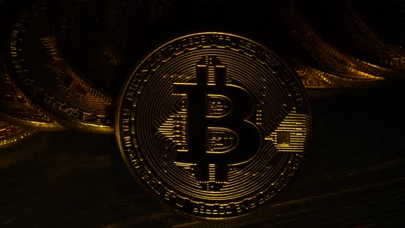 Gold Coins Bitcoin in the Twinkling of Light. Close Up