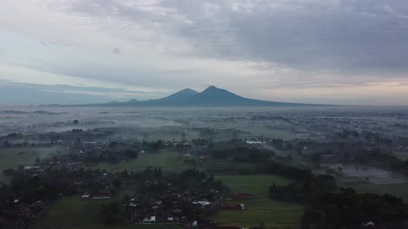 Aerial view of foggy morning with beautiful and exotic views of two mountains