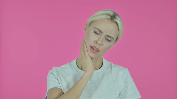 Toothache, Young Woman with Tooth Pain on Pink Background