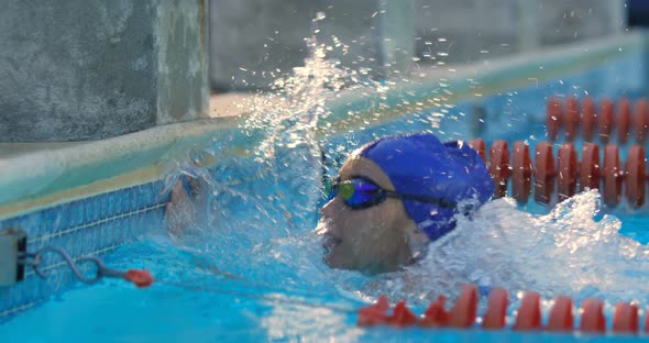 Female swimmer disappointed and splashes water in pool 4k