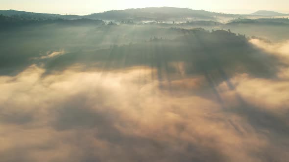 4K Aerial view flying in fog. flight above clouds.