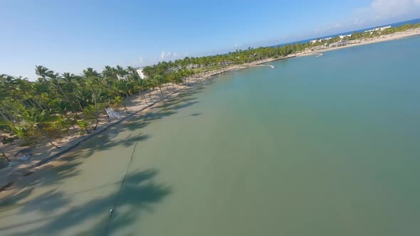 Drone fpv flying along Playa Nueva Romana beach, Dominican Republic