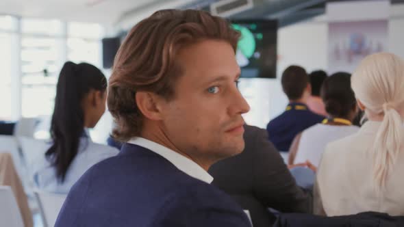 Portrait of a man in the audience at a business conference