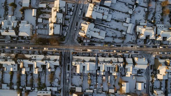 Snowy Streets and Houses in the Early Morning Bird's Eye View