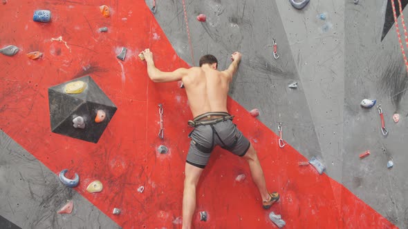 Strong Man Enjoying Rock Climbing