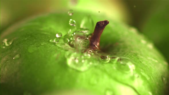 Super Slow Motion on the Green Apple Drop Water with Splashes