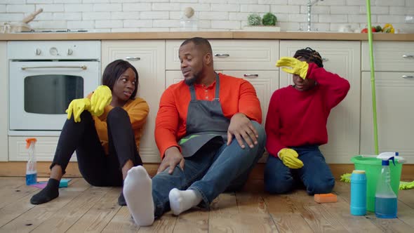 Joyful Single Parent Family Giving High Five After Cleanup