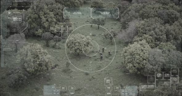 Surveillance drone view of soldiers walking through a forest with hud graphics